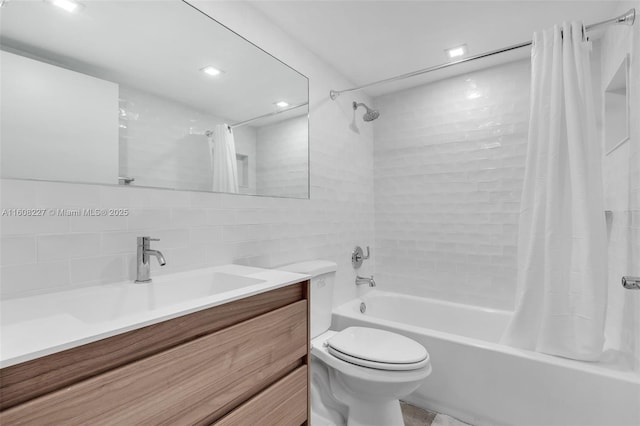 full bathroom featuring vanity, shower / bath combination with curtain, decorative backsplash, toilet, and tile walls