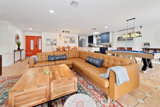 living room featuring light tile patterned floors and pool table