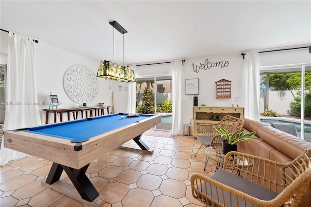 recreation room with plenty of natural light and billiards