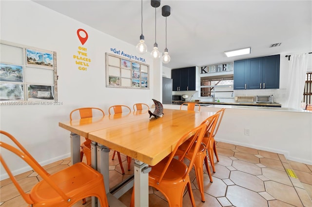 tiled dining area with sink