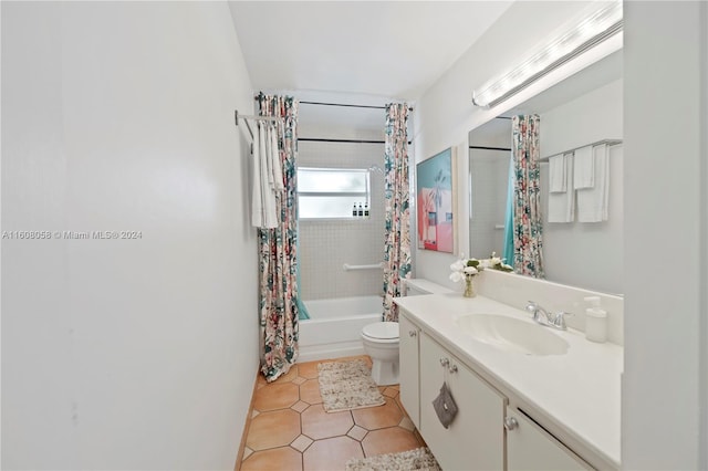 full bathroom with toilet, vanity, tile patterned flooring, and shower / tub combo with curtain