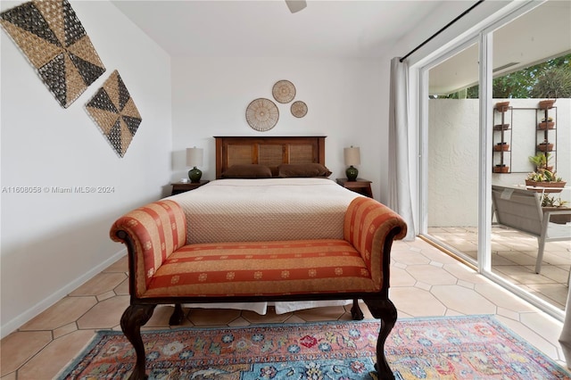 tiled bedroom featuring ceiling fan