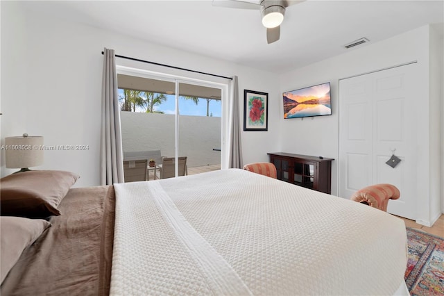 bedroom with access to outside and ceiling fan