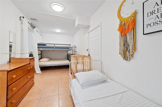 bedroom with light tile patterned flooring