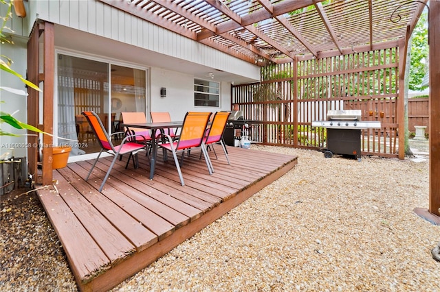 wooden deck with a grill and a pergola