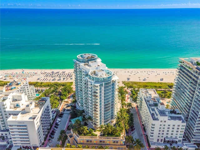 bird's eye view featuring a view of city, a beach view, and a water view