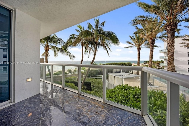 balcony featuring a water view