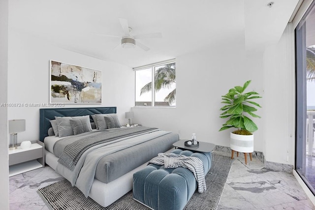 bedroom featuring a ceiling fan and marble finish floor