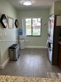 kitchen featuring stainless steel fridge