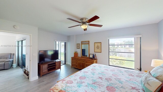 bedroom with ceiling fan and hardwood / wood-style flooring