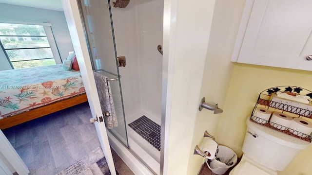 bathroom featuring toilet and hardwood / wood-style flooring