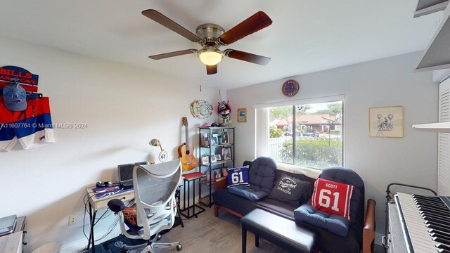 home office featuring hardwood / wood-style flooring and ceiling fan