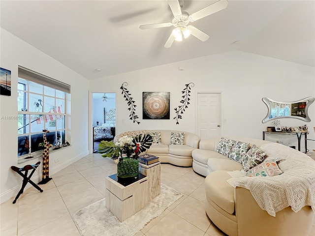 living room featuring lofted ceiling, ceiling fan, and light tile floors