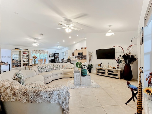 tiled living room featuring ceiling fan