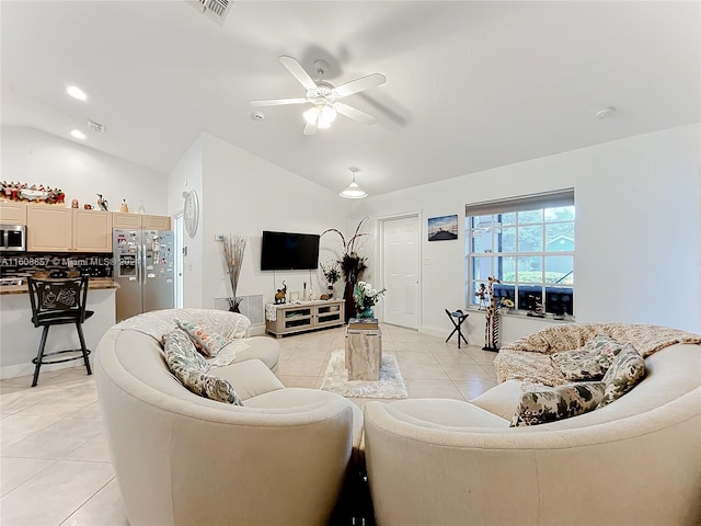 tiled living room with ceiling fan and lofted ceiling