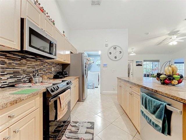 kitchen with backsplash, appliances with stainless steel finishes, ceiling fan, and light tile floors