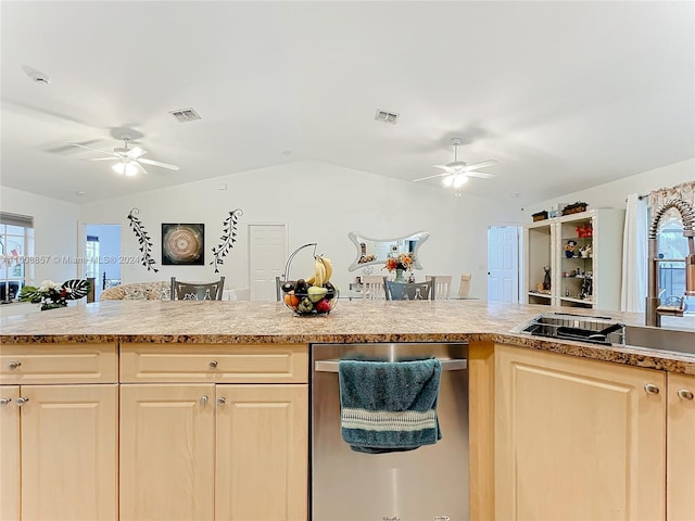 kitchen featuring ceiling fan, lofted ceiling, and stainless steel dishwasher