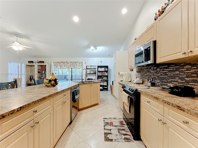 kitchen with stainless steel appliances, sink, tasteful backsplash, ceiling fan, and light tile floors