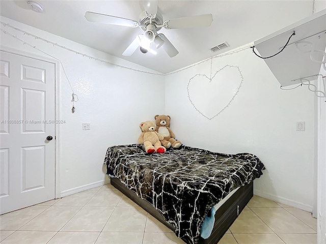 tiled bedroom with ceiling fan