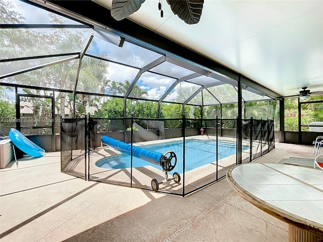 view of pool with a lanai and a patio area