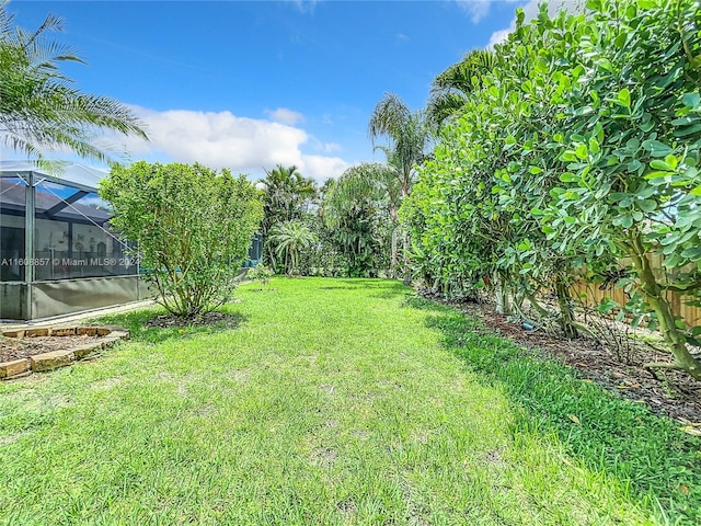 view of yard with a lanai