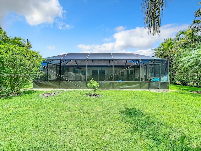 view of yard with glass enclosure