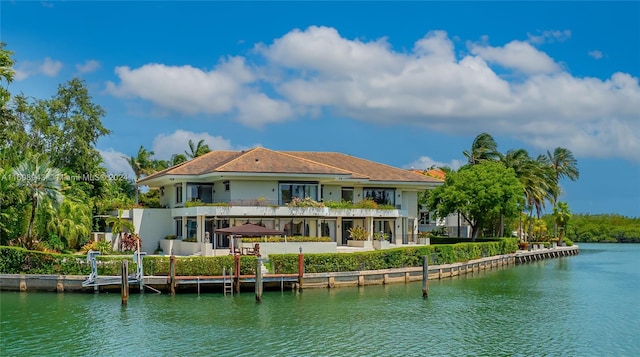 rear view of property featuring a water view