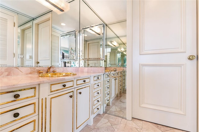 bathroom with tile patterned floors and vanity