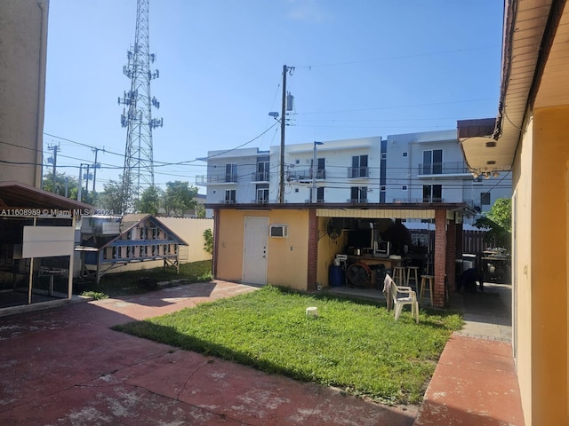 exterior space with a garage and a yard