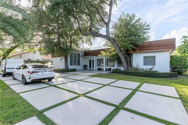 view of front of property with a front lawn