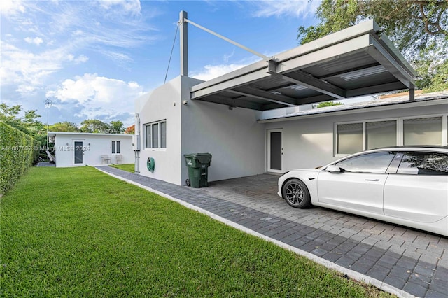 view of property exterior featuring a lawn and a carport