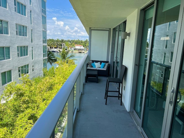 balcony featuring a water view