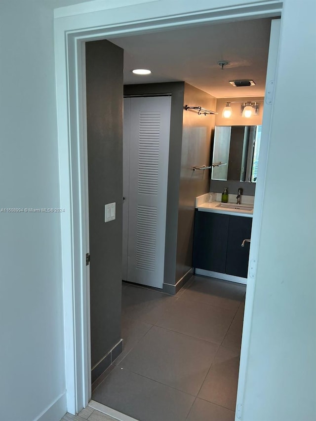 bathroom featuring tile patterned flooring and vanity