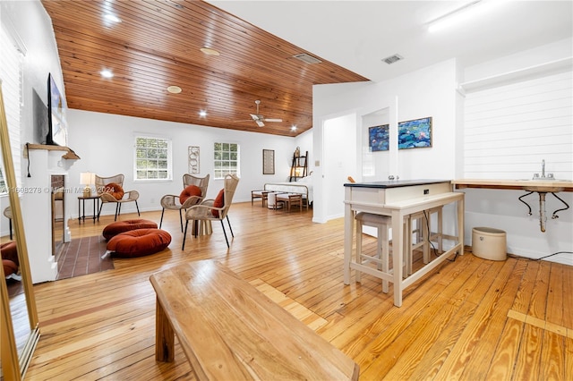 interior space featuring light wood-type flooring, ceiling fan, lofted ceiling, and wood ceiling