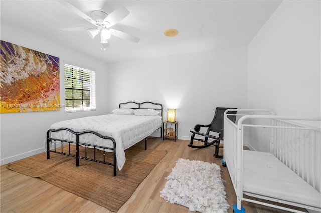 bedroom featuring ceiling fan and hardwood / wood-style flooring