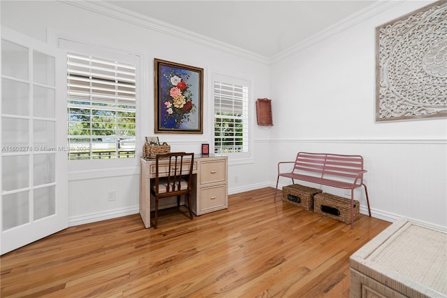 office area featuring light hardwood / wood-style flooring and crown molding