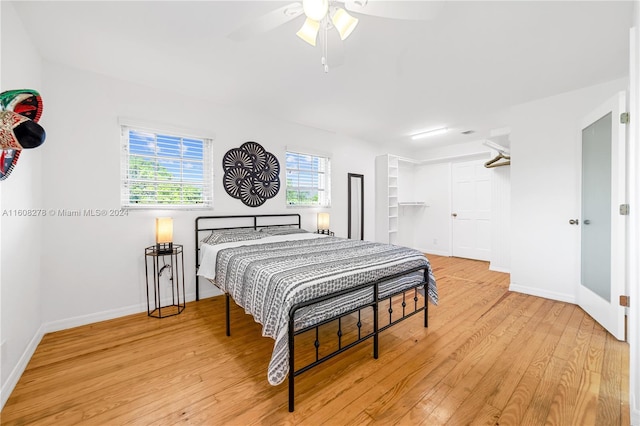 bedroom with light hardwood / wood-style flooring and ceiling fan