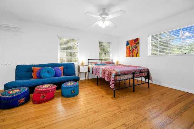 bedroom with wood-type flooring and ceiling fan