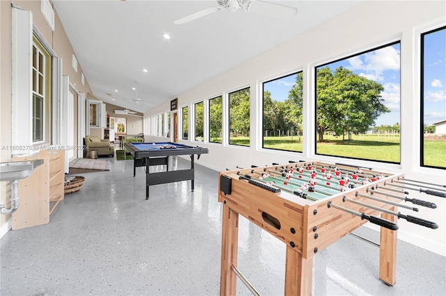 rec room with ceiling fan, pool table, and vaulted ceiling