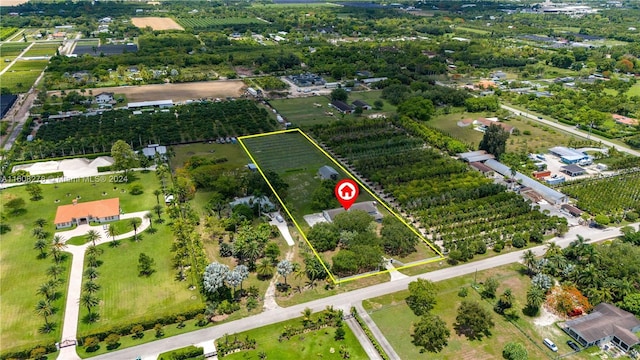 birds eye view of property featuring a rural view