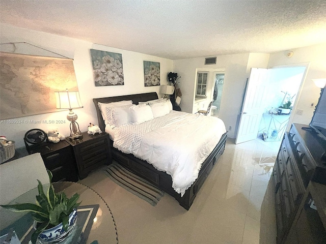 bedroom featuring a textured ceiling