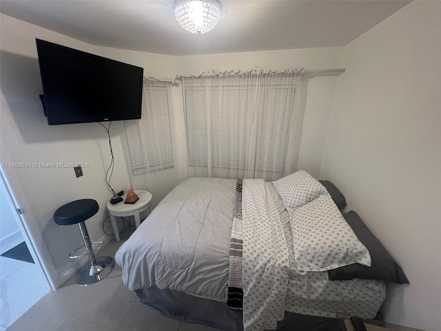 bedroom with tile patterned floors