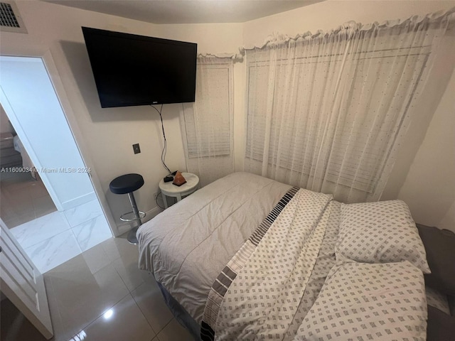 bedroom with tile patterned flooring