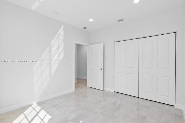 unfurnished bedroom featuring a closet