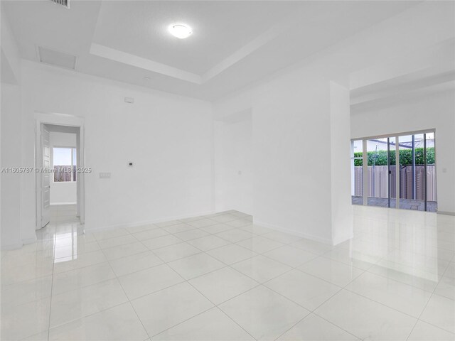 kitchen with white cabinetry, appliances with stainless steel finishes, a center island, and decorative light fixtures