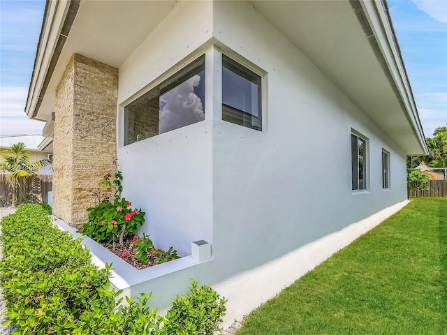 view of property exterior featuring a yard