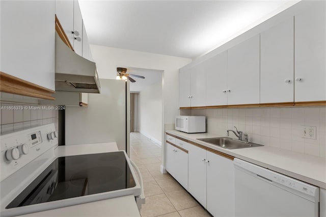 kitchen featuring sink, white cabinetry, white appliances, and tasteful backsplash