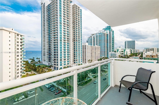 balcony featuring a water view