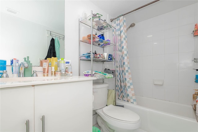 full bathroom with vanity, shower / tub combo with curtain, and toilet