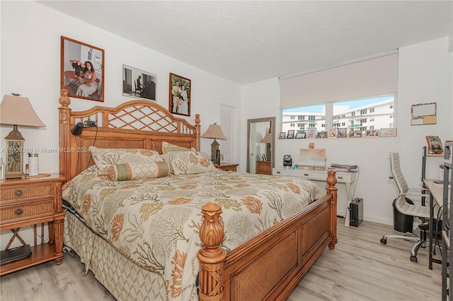 bedroom featuring light wood-type flooring